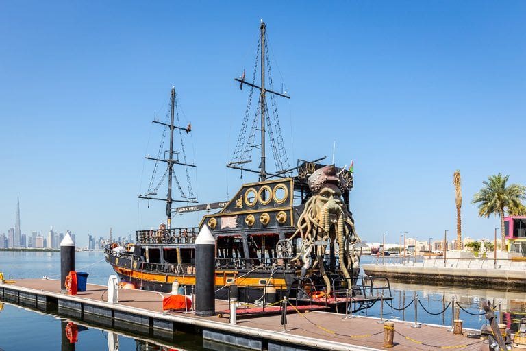 Black Pearl Pirate Ship by Tour Dubai, docked at Dubai Creek Harbour, United Arab Emirates, with Dubai Downtown and Burj Khalifa in the background