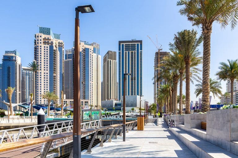 Dubai Creek Marina promenade, with skyscrapers in the background