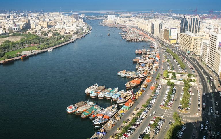 An aerial view of wooden dhows on the Deira side of Dubai Creek
