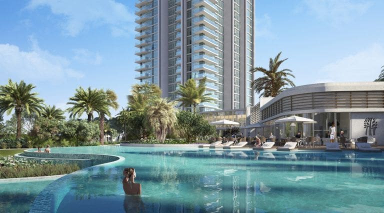 swimming pool with palm trees and a residential building
