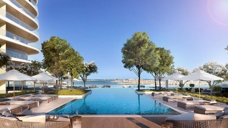 outdoor community pool in grand blue tower residential complex