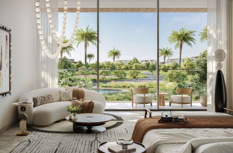 bedroom interior with sitting area overlooking lush greenery and waterways in a luxury mansion in lavita by emaar in the oasis