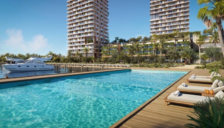 view of pool with yacht access and orise by beyond buildings in the background