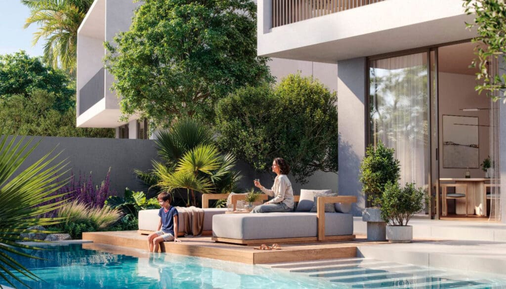 mother and child by private pool in farm grove villa at the valley